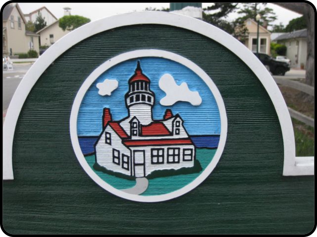 Lighthouse carving on Pacific Grove sign