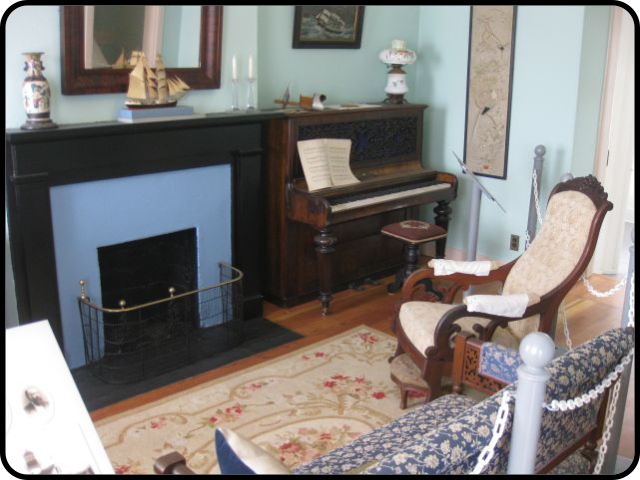 Parlor fireplace and piano